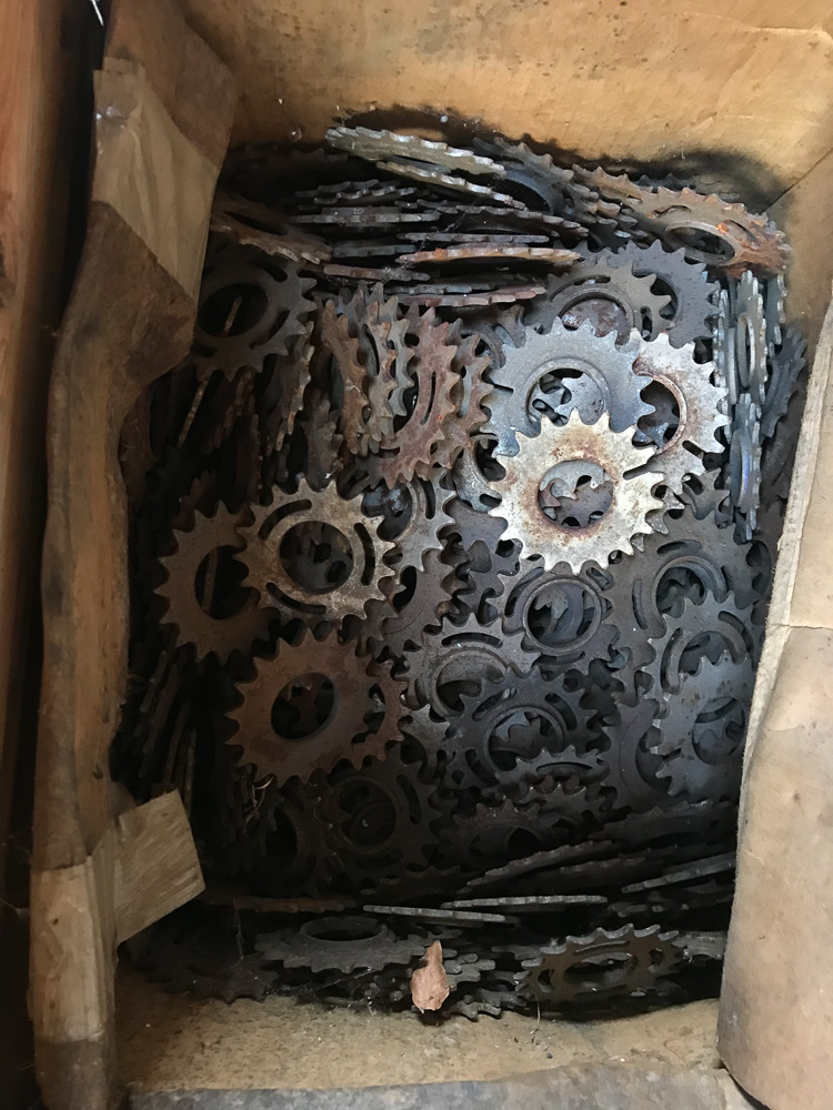 Closeup of artwork Matter of Life by Marisja Smit. Detail of material: steel bicycle gears. Repurposed. 