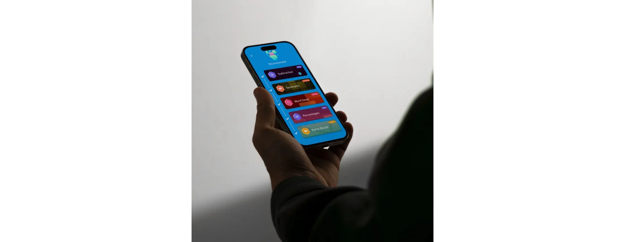 Person holding a phone using Elevate, the brain training app.