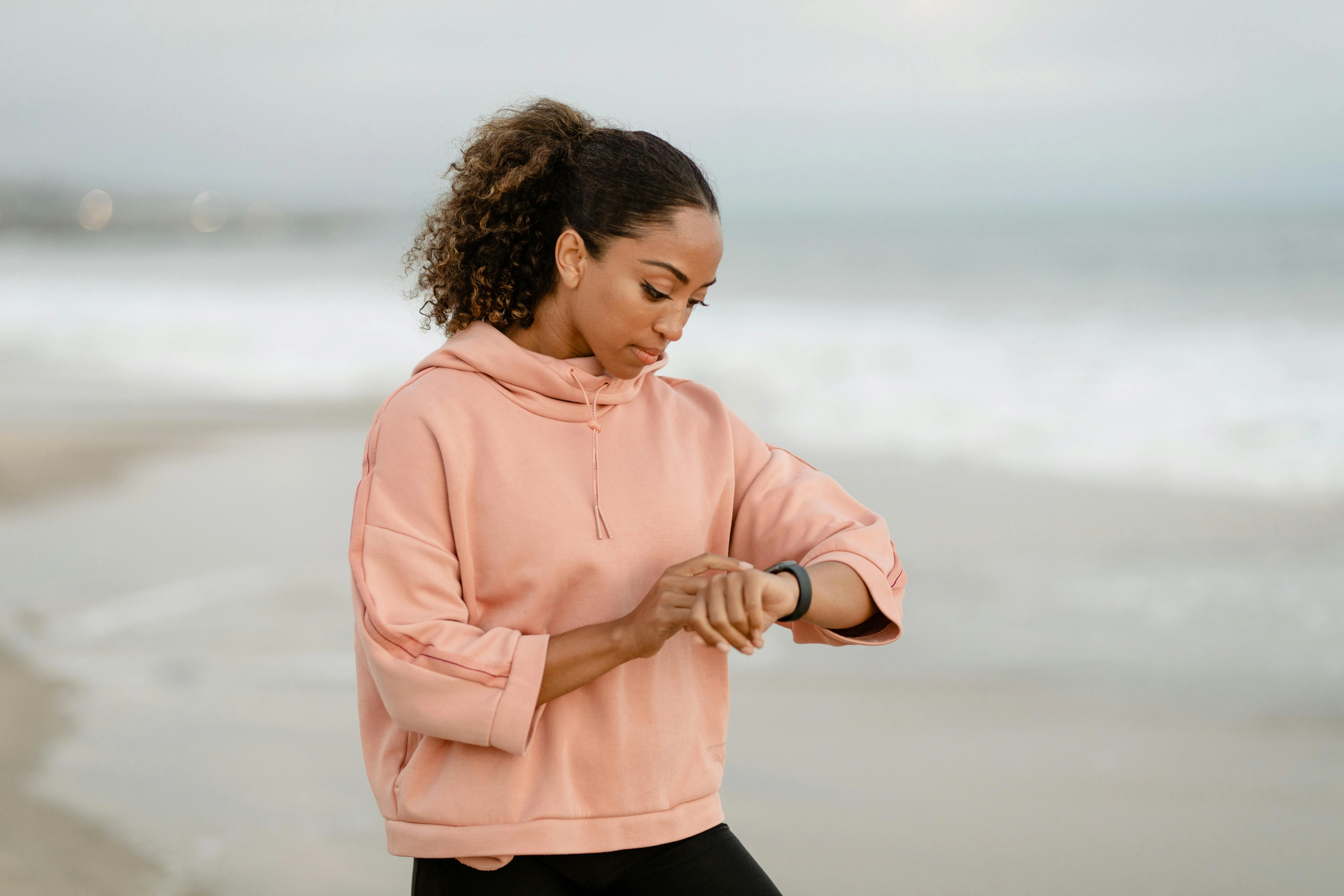 A person glancing at their watch, symbolizing time perception and how the brain interprets passing moments.
