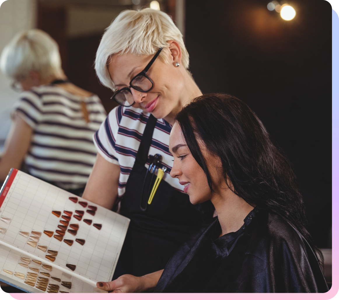 Beauty professional in a salon using SalonInteractive to grow their business