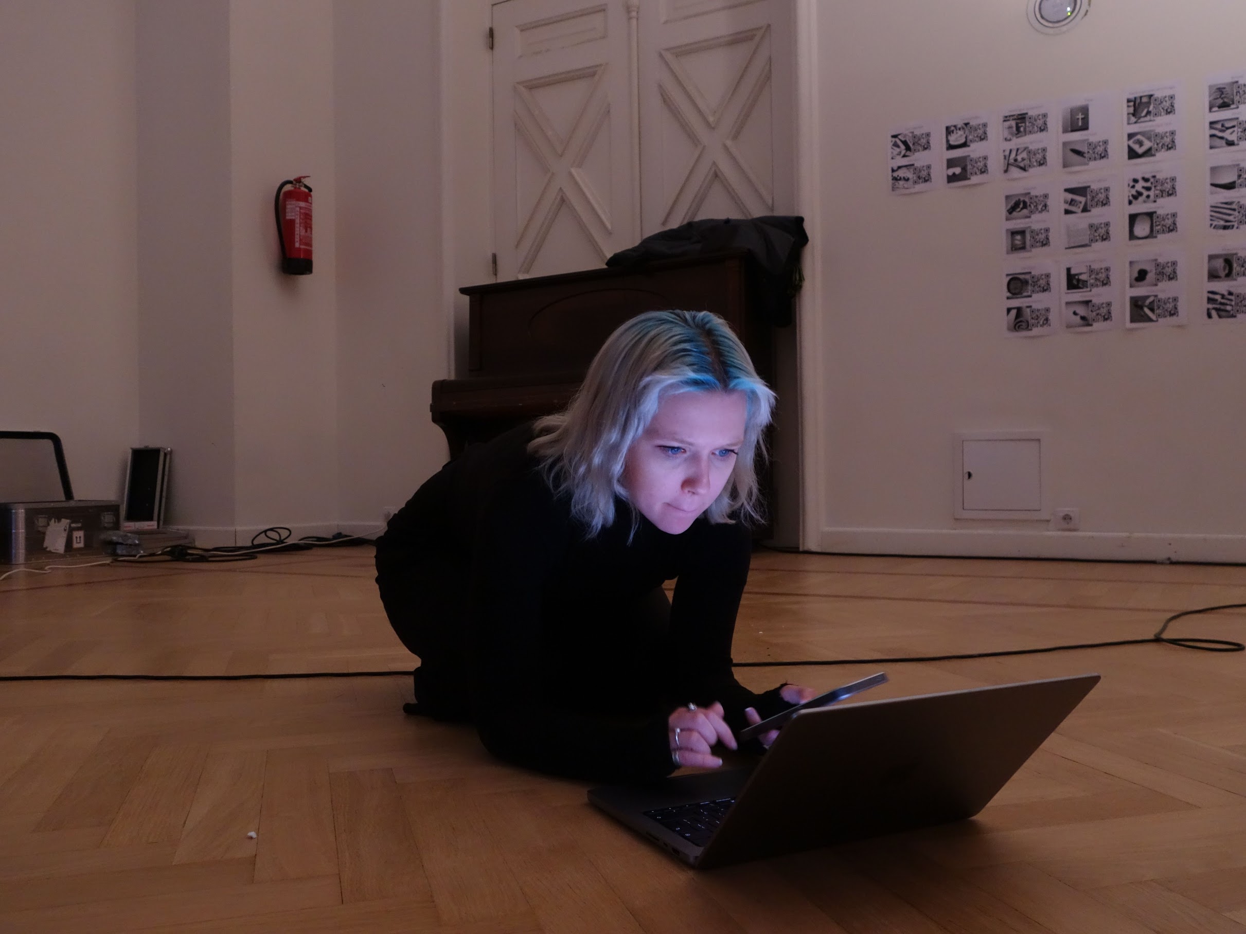 Woman sitting on floor with laptop