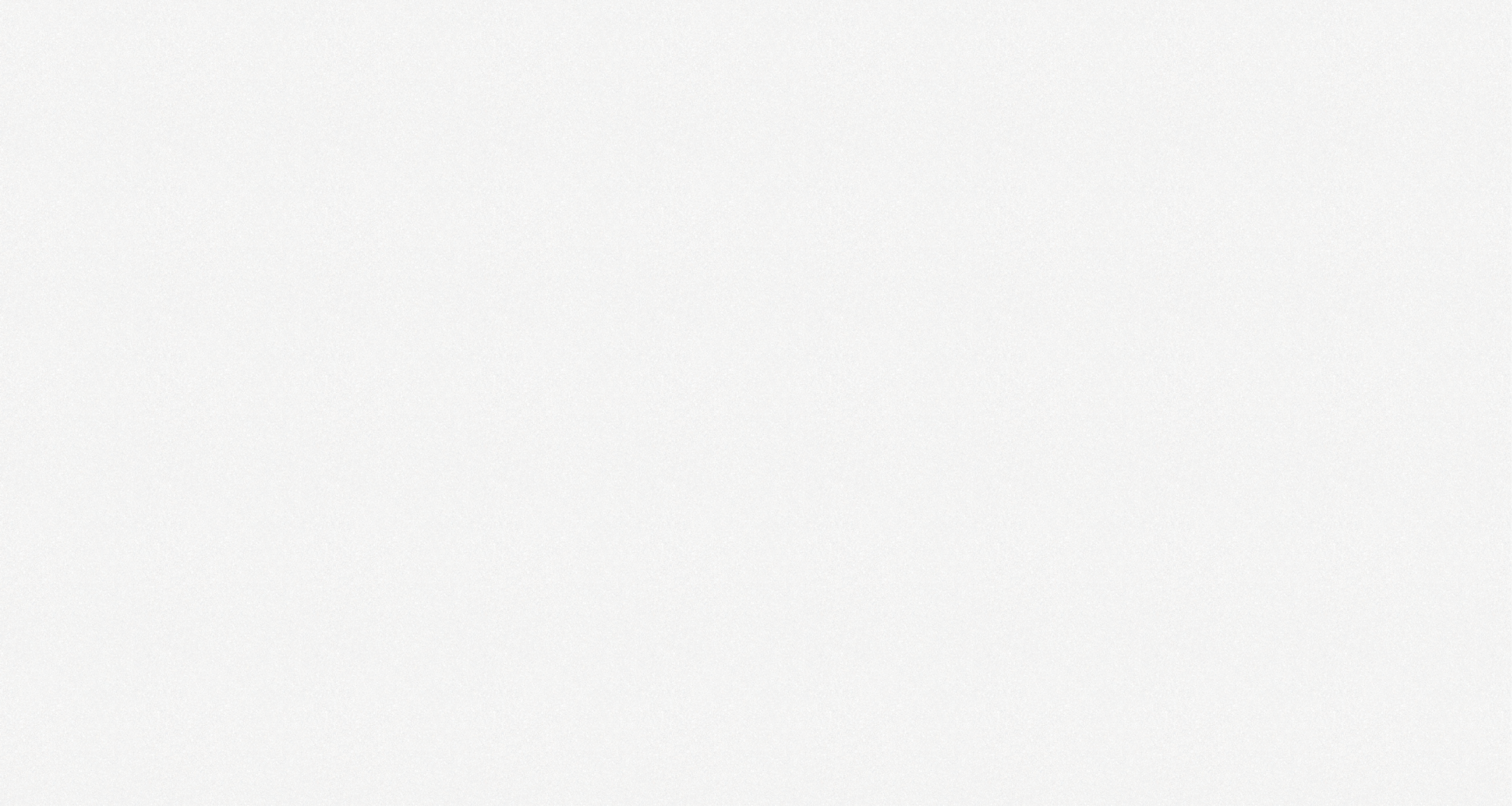 Close-up texture of rough gray stone surface with fine granules and speckled pattern.