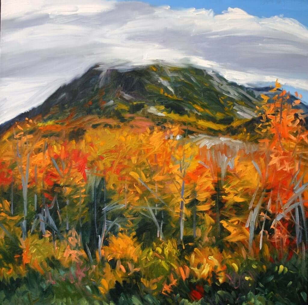 Autumn mountain landscape with vibrant orange and yellow trees