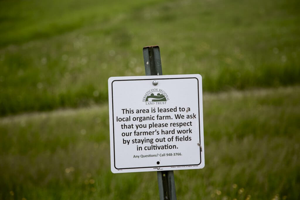 Sign warning visitors to stay out of leased organic farm fields