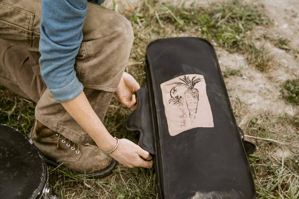 Skateboard with hand-drawn carrot sketch on grassy ground