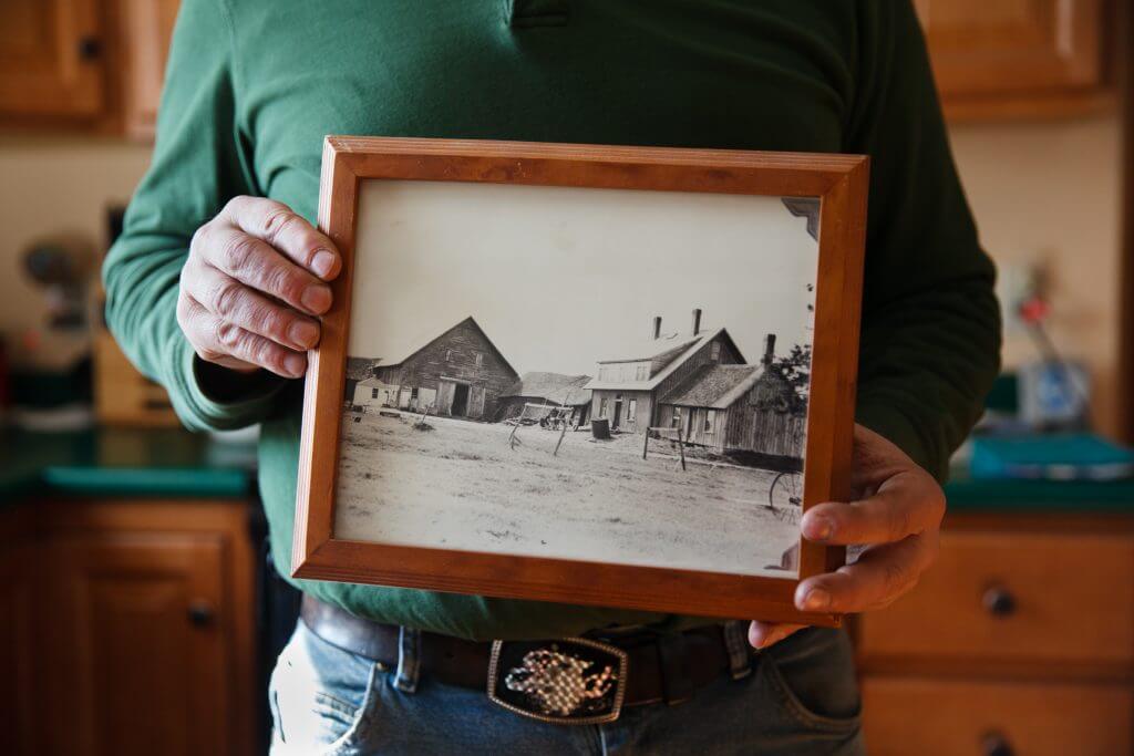 Vintage black and white photo of rural buildings and farm scene