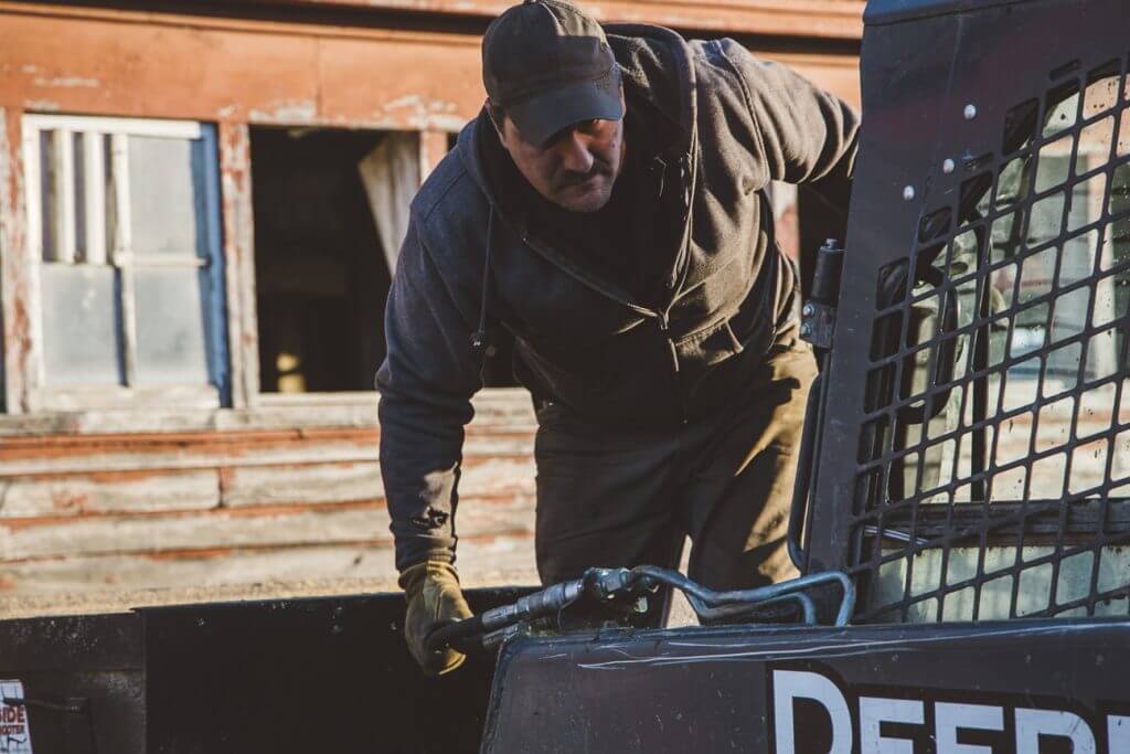 A man working on the back of a truck