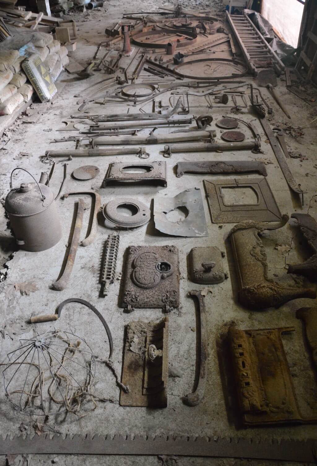 Dusty collection of vintage industrial tools and machinery parts