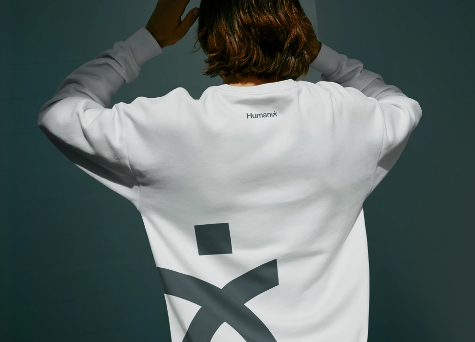 Branded apparel with a logo on the back of a t-shirt