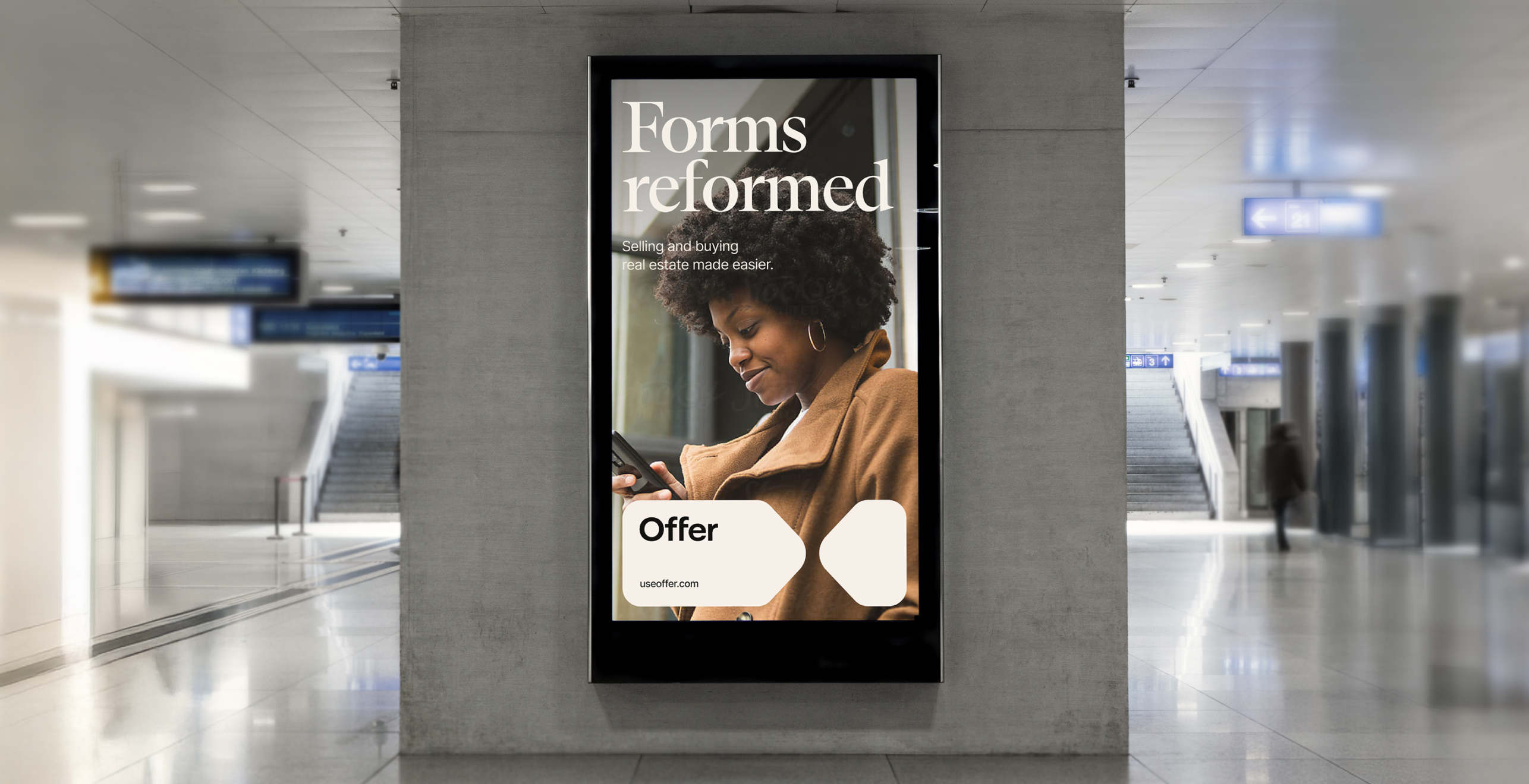 Brand campaign poster displayed in a train station