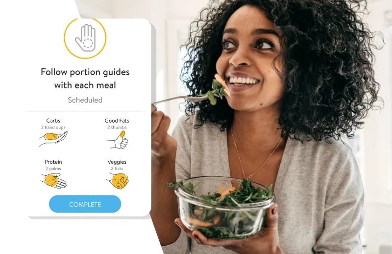 Woman eating salad - nutrition hand portion guide