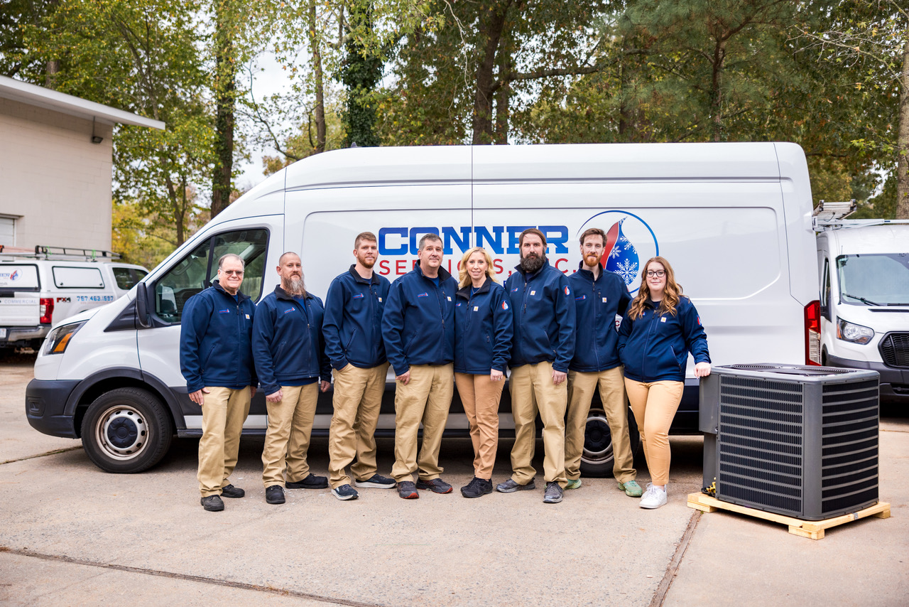 The conner services team standing proudly with unity