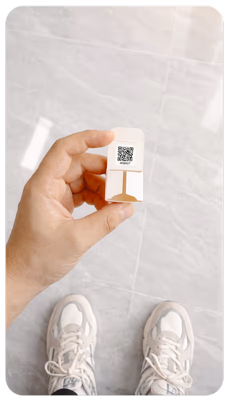 Real-life photo: QR code with unique identifier inside product packaging