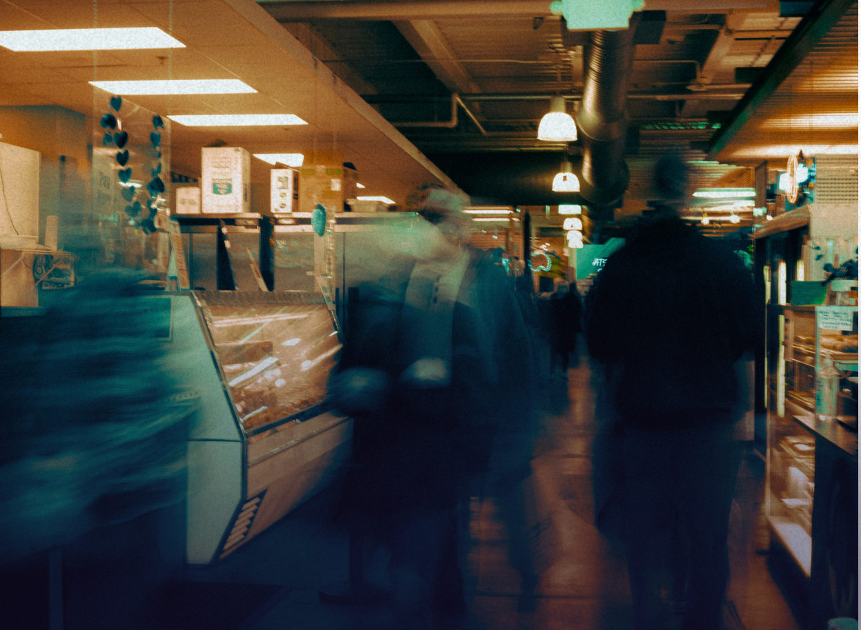 People rushing through a crowded marketplace