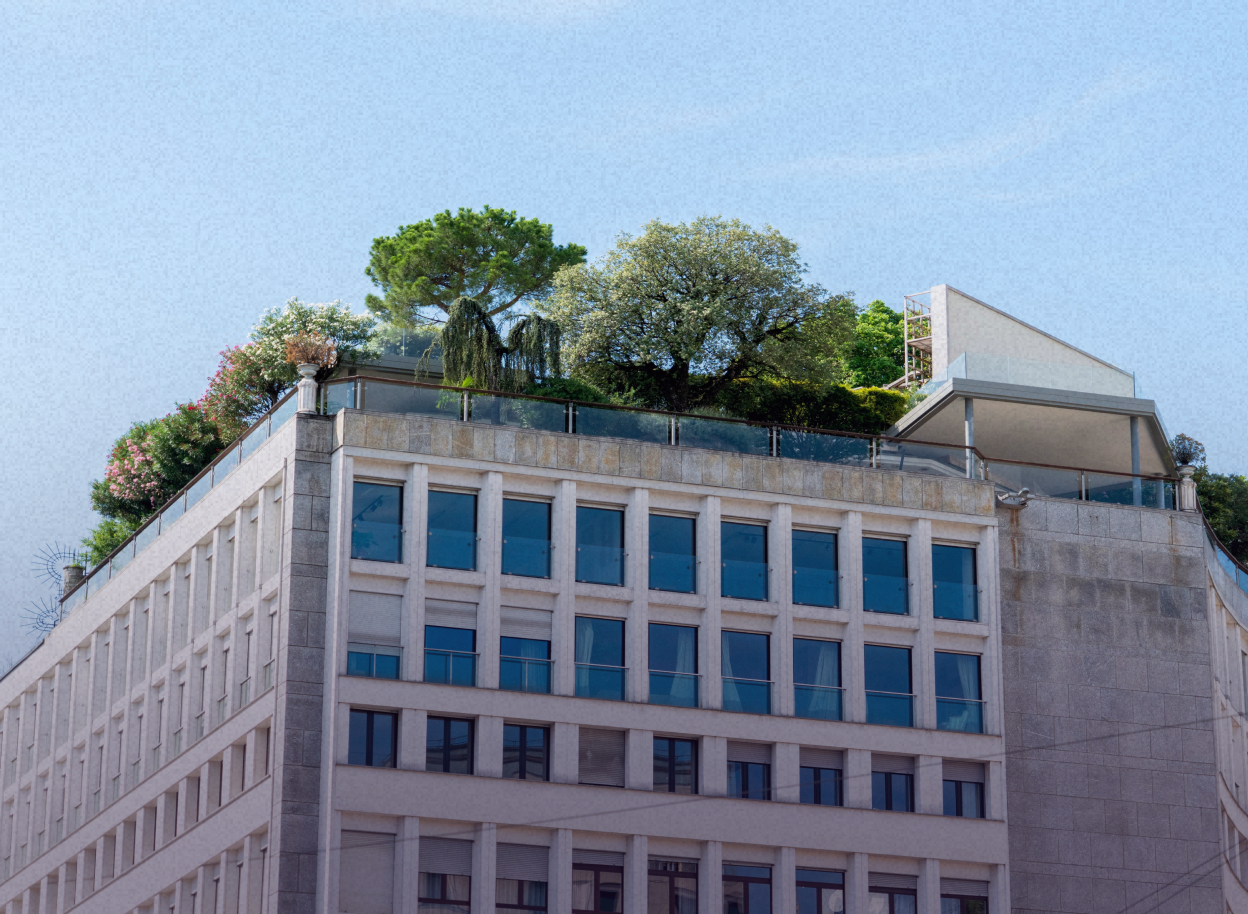 A modern building featuring lush rooftop gardens under a clear blue sky.
