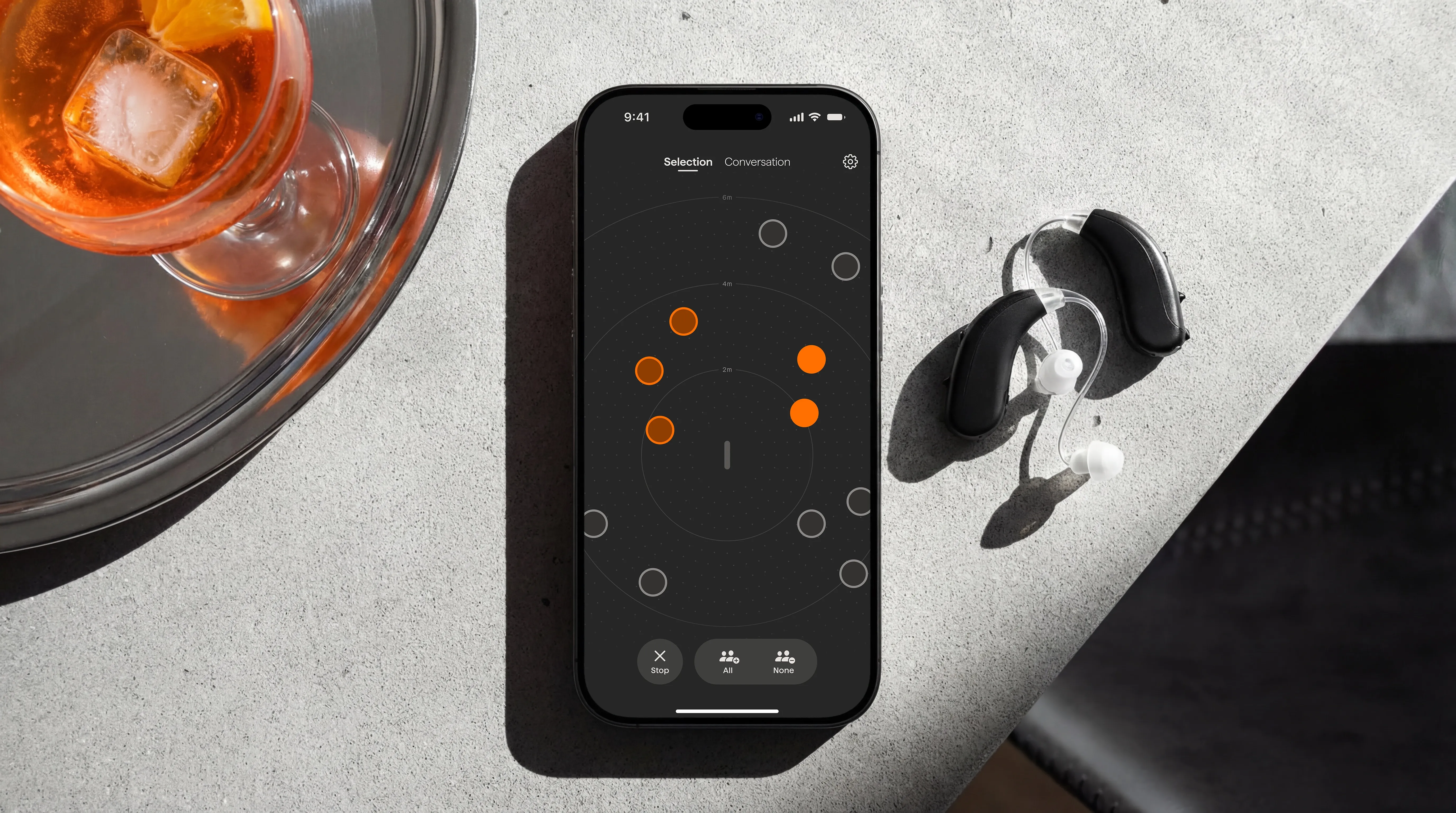 Noto app used with hearing aids in a bar