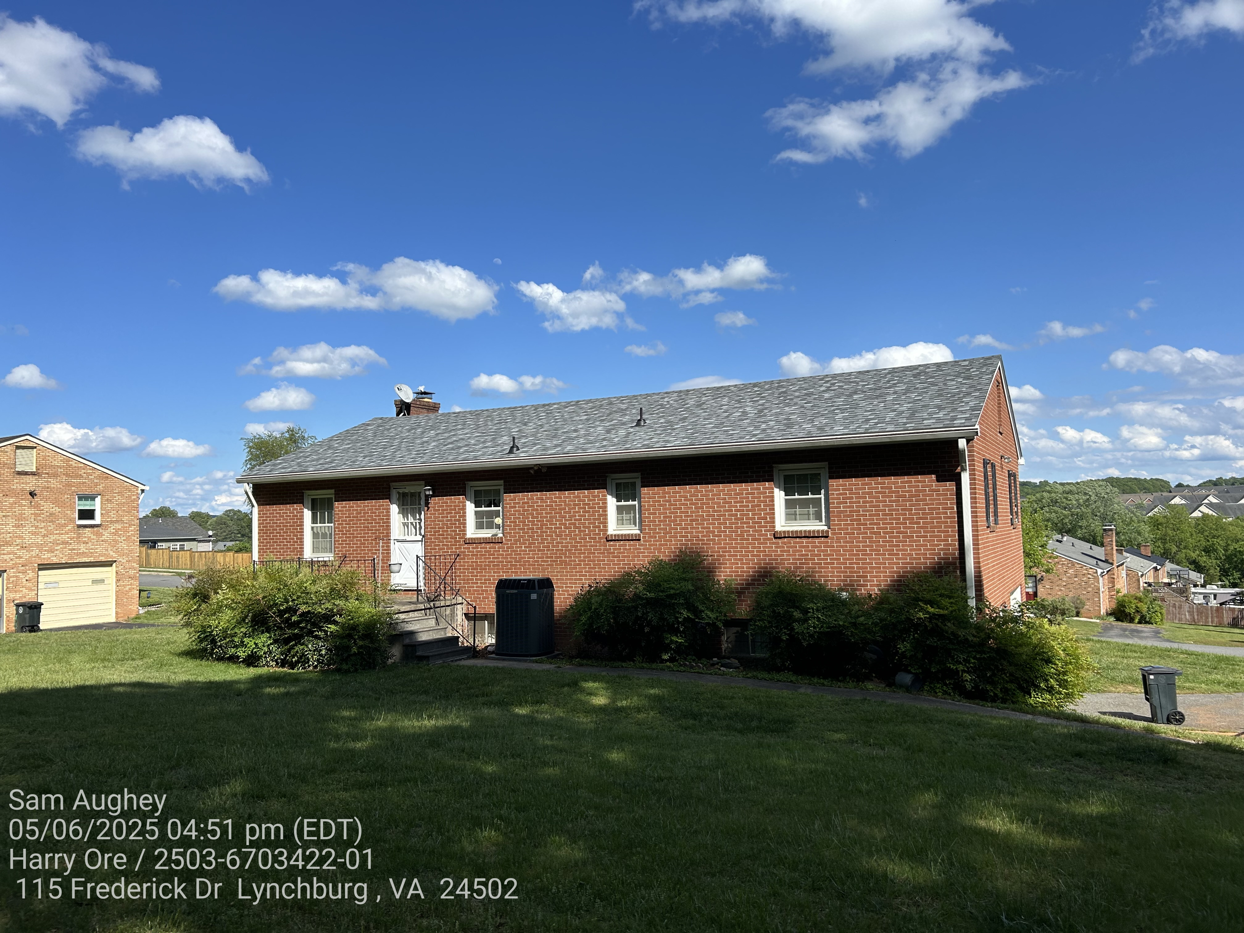 A brick house with Slatestone Gray shingles.