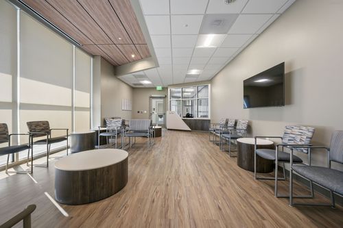 A room featuring wooden flooring, with walls and furniture that complements the interior design.