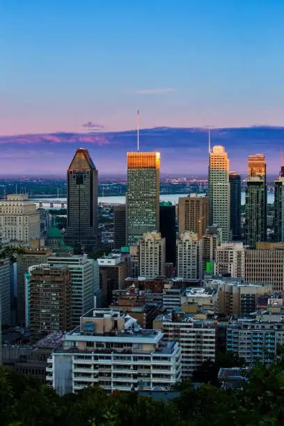 Downtown Montreal, Quebec skyline with modern skyscrapers and city views overlooking the Saint Lawrence River.