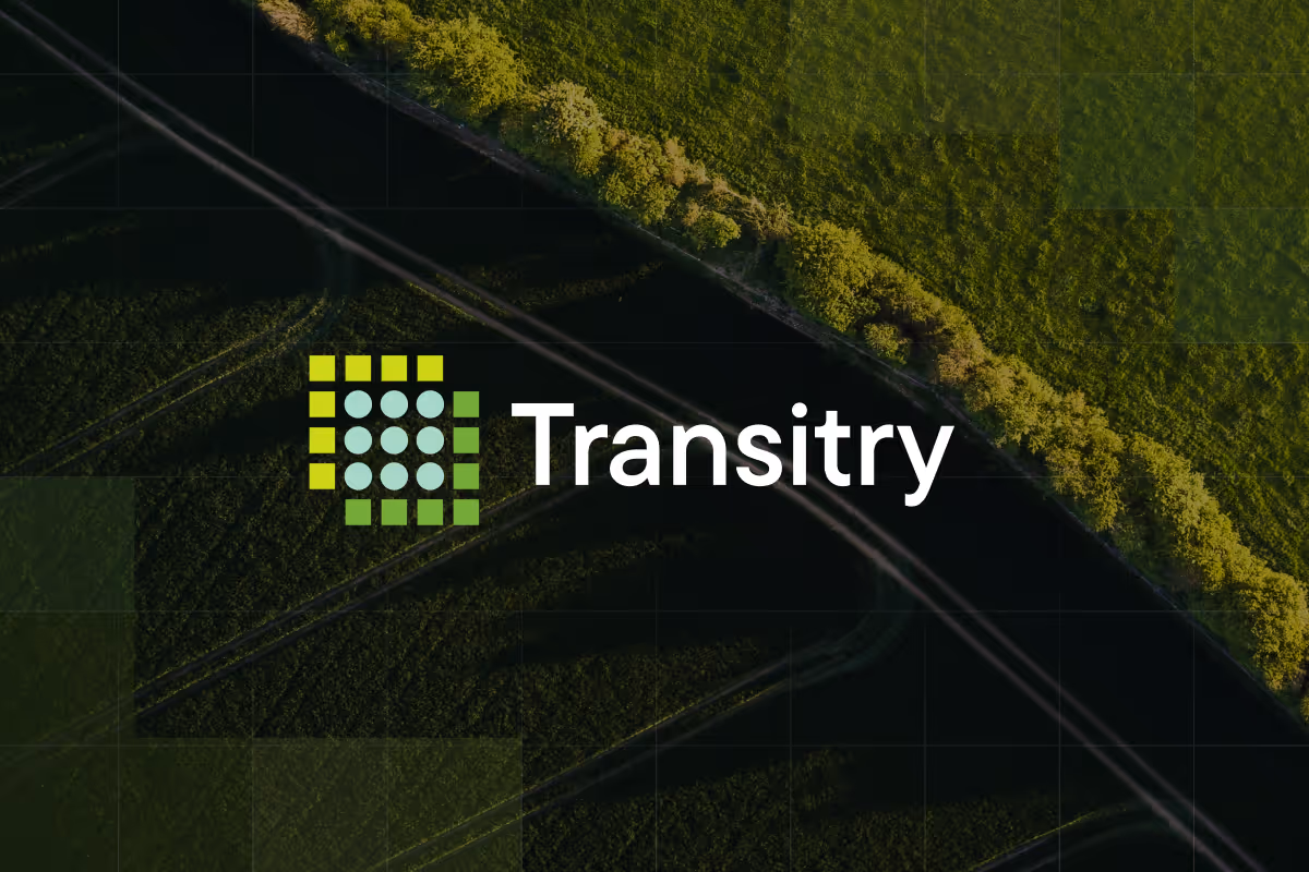 Transistry logo with stylized grid of green and blue circles and squares on a dark green aerial field background.