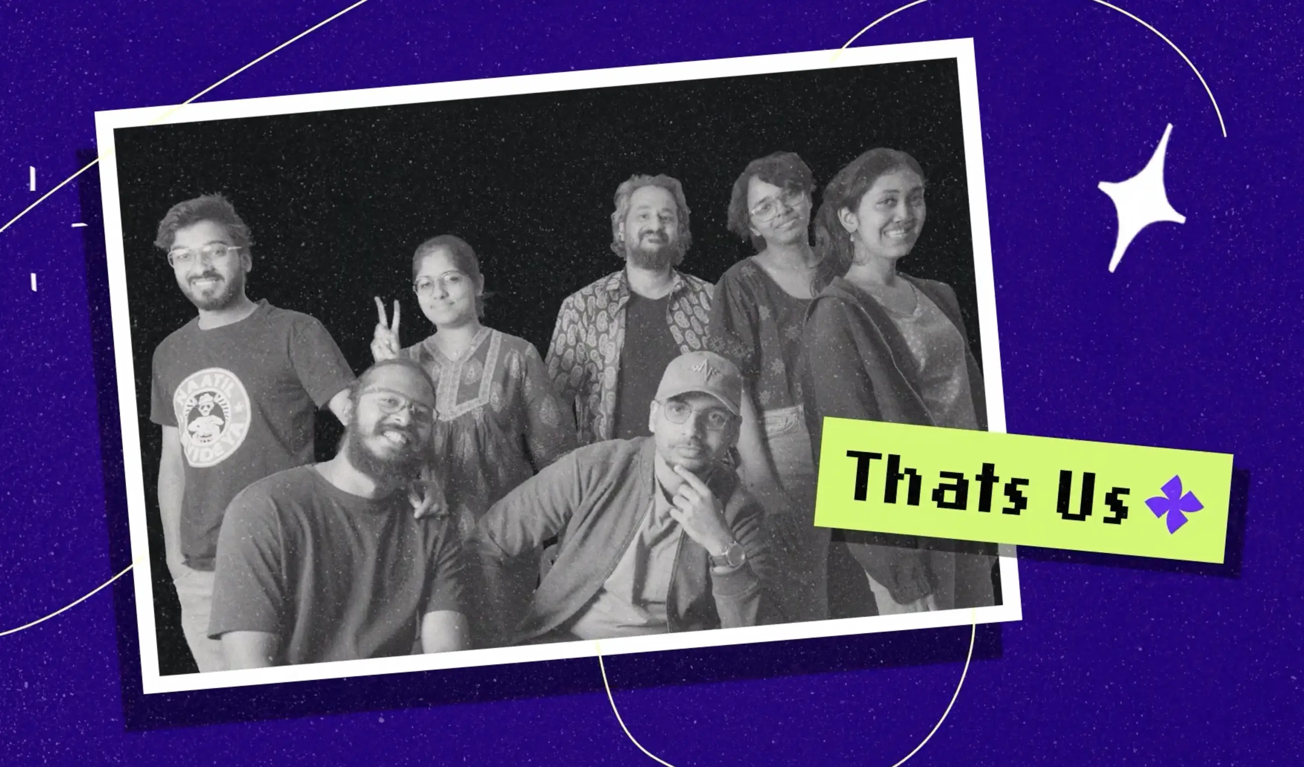 Group photo of seven smiling people with a caption 'Thats Us' on a green label, set on a purple starry background.