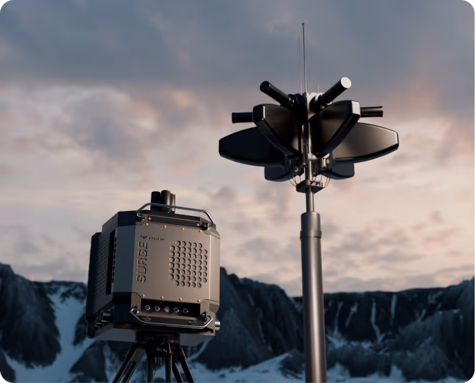 High-tech surveillance or defense equipment setup outdoors with snowy mountains in the background.