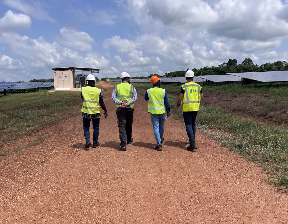 Renewable energy consultant team inspecting a PV farm