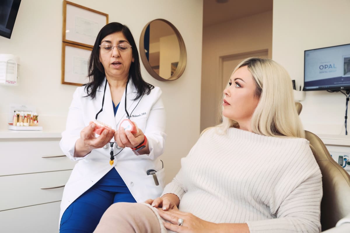 Full mouth restoration treatment discussion at Opal Dental Group in Dupont