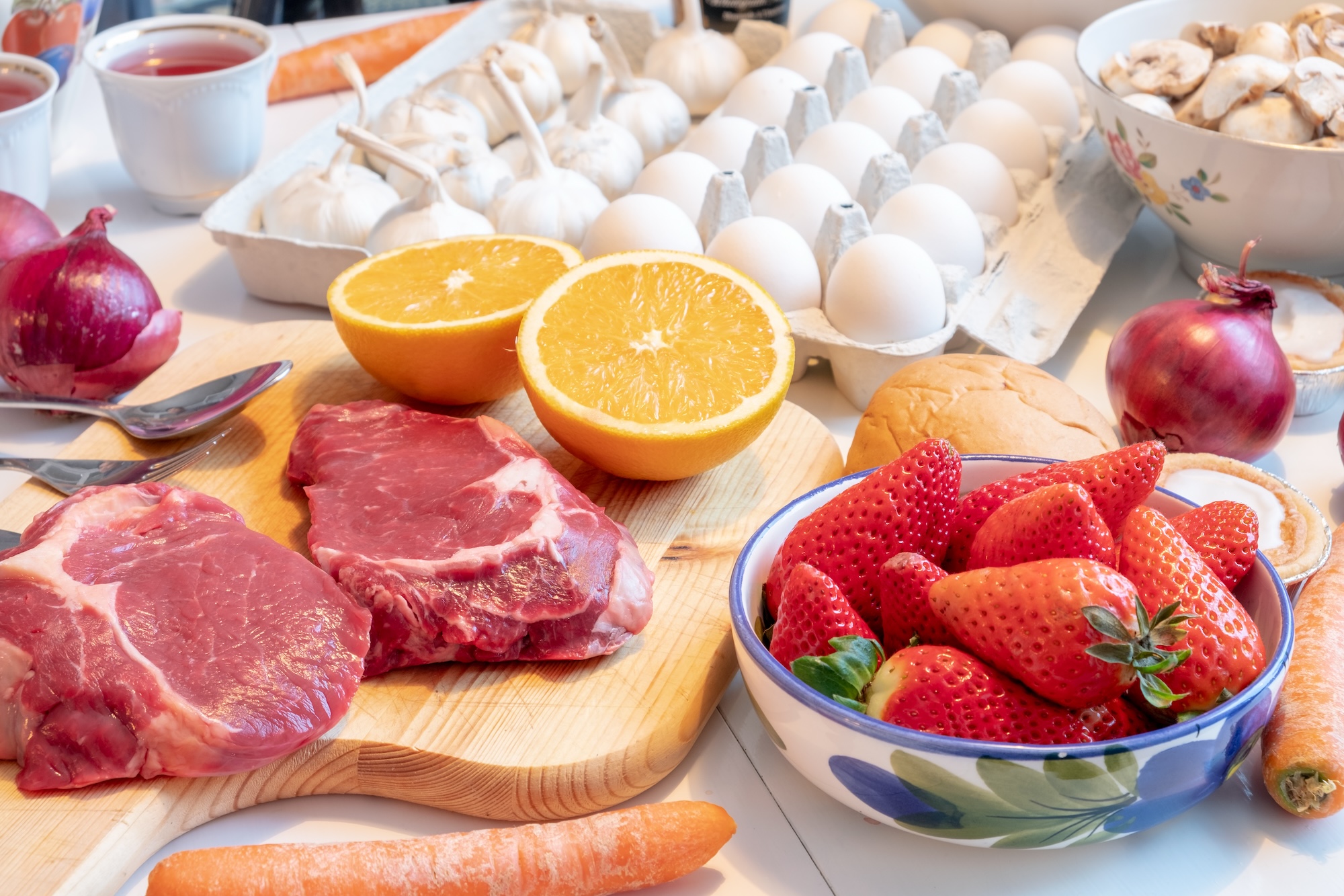 a layout of farm fresh products such as meat eggs and fruits