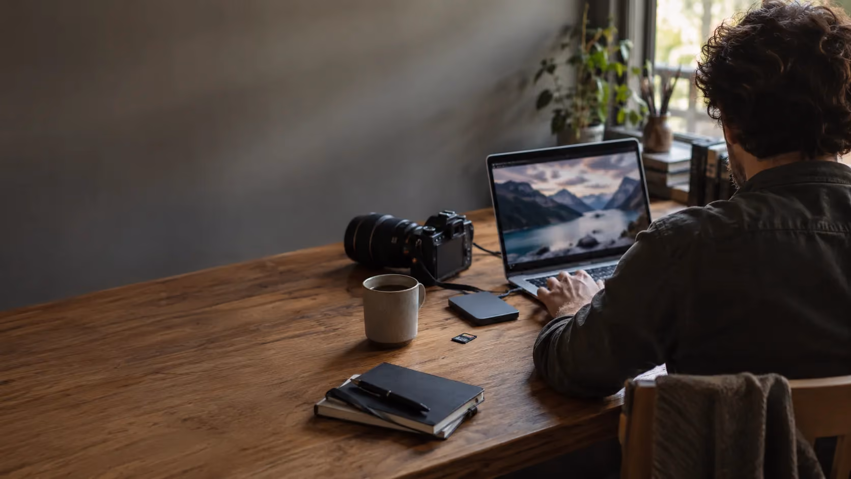 Illustrative AI-created photographer workspace with a camera, memory card and laptop.