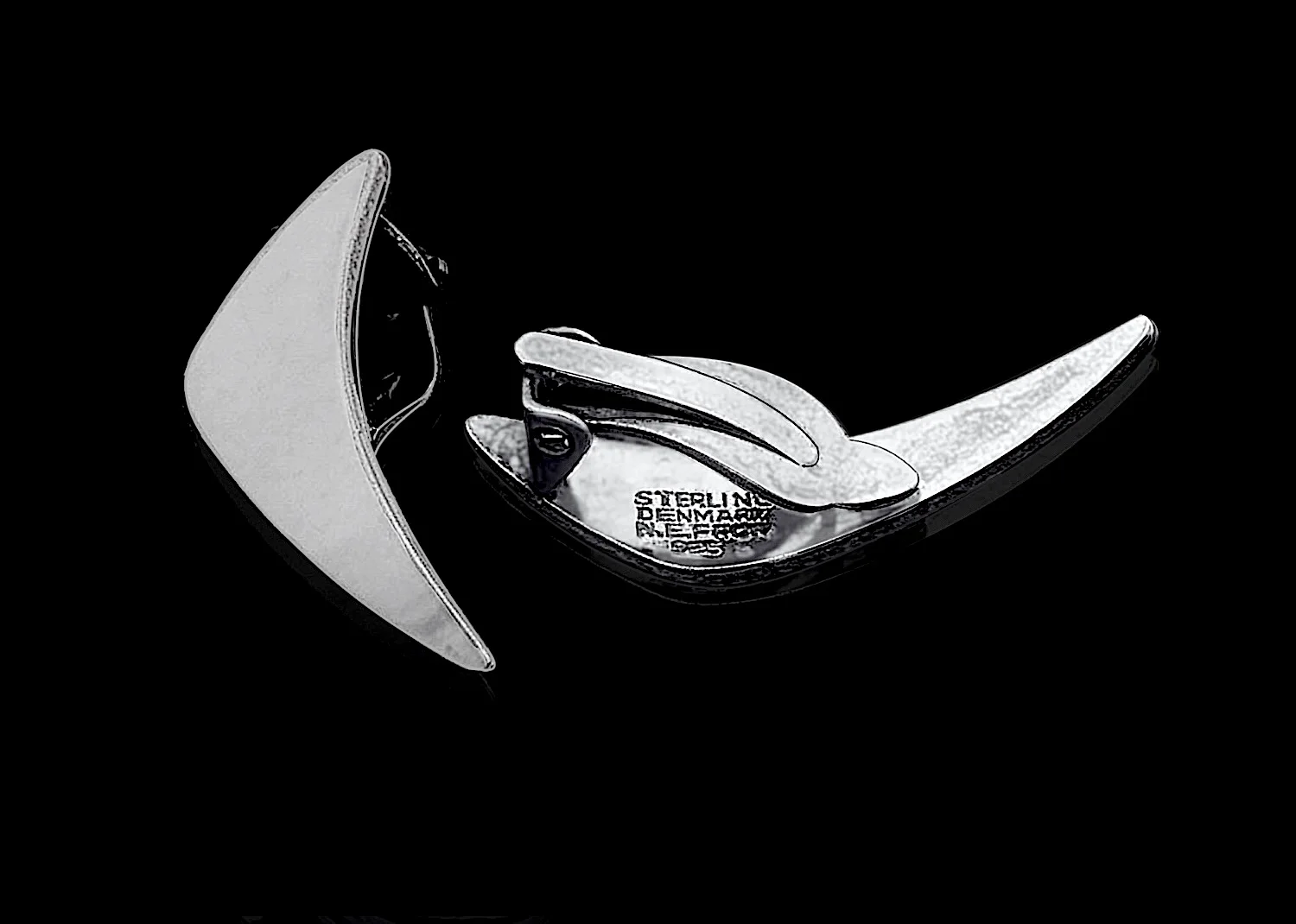 N E From silver clip earrings