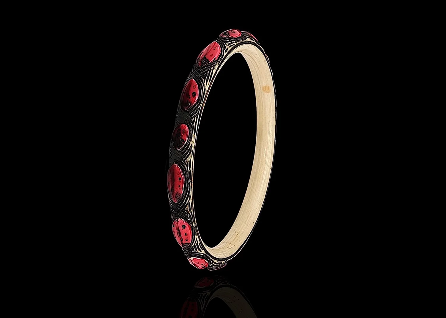 Art Deco cream & red carved celluloid bug bangle
