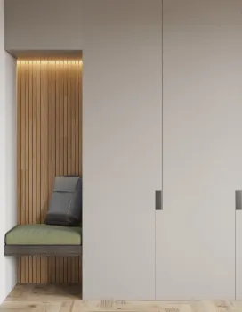 Minimalist modern closet with integrated wood-paneled seating nook featuring green cushion and dark pillow.