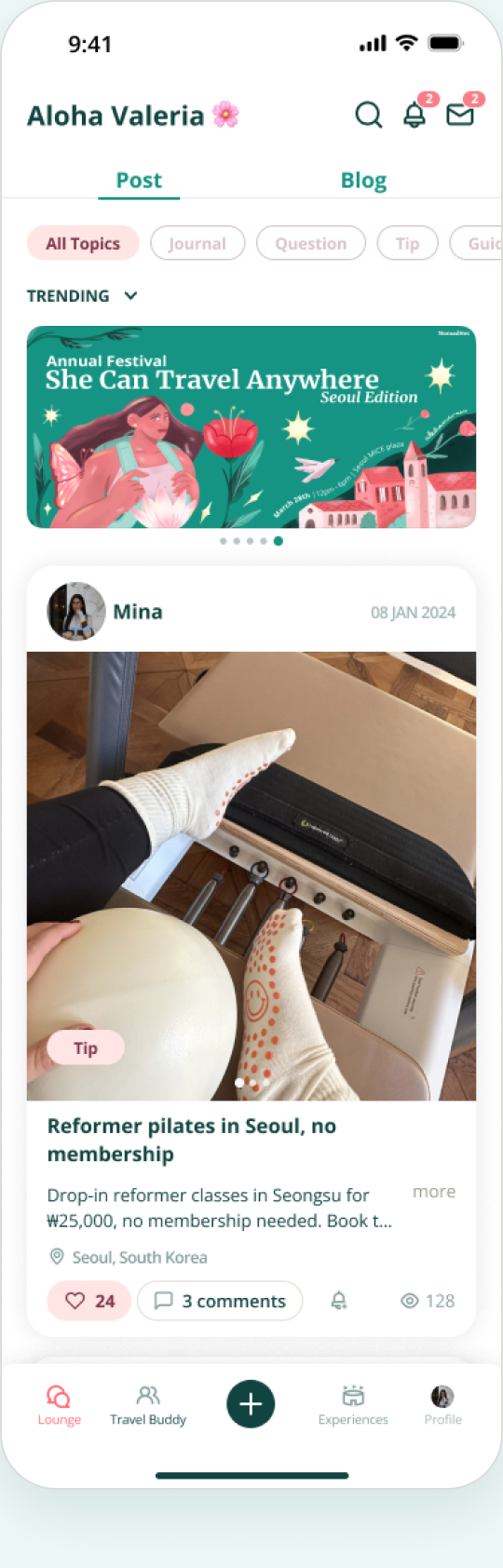 Mobile app interface showing a user named Aloha Valeria with a flower emoji. The screen displays tabs for Post and Blog, filtered by All Topics. A trending banner for 'Annual Festival She Can Travel Anywhere Seoul Edition' is at the top. Below, a post by Mina dated 08 Jan 2024 features a photo of a person doing reformer pilates wearing white socks with orange grips and a smiley face, holding a pilates ball. The post is titled 'Reformer pilates in Seoul, no membership' and mentions drop-in classes in Seongsu for ₩25,000 with no membership needed. The post has 24 likes, 3 comments, and 128 views. Navigation icons for Lounge, Travel Buddy, Experiences, and Profile are at the bottom.