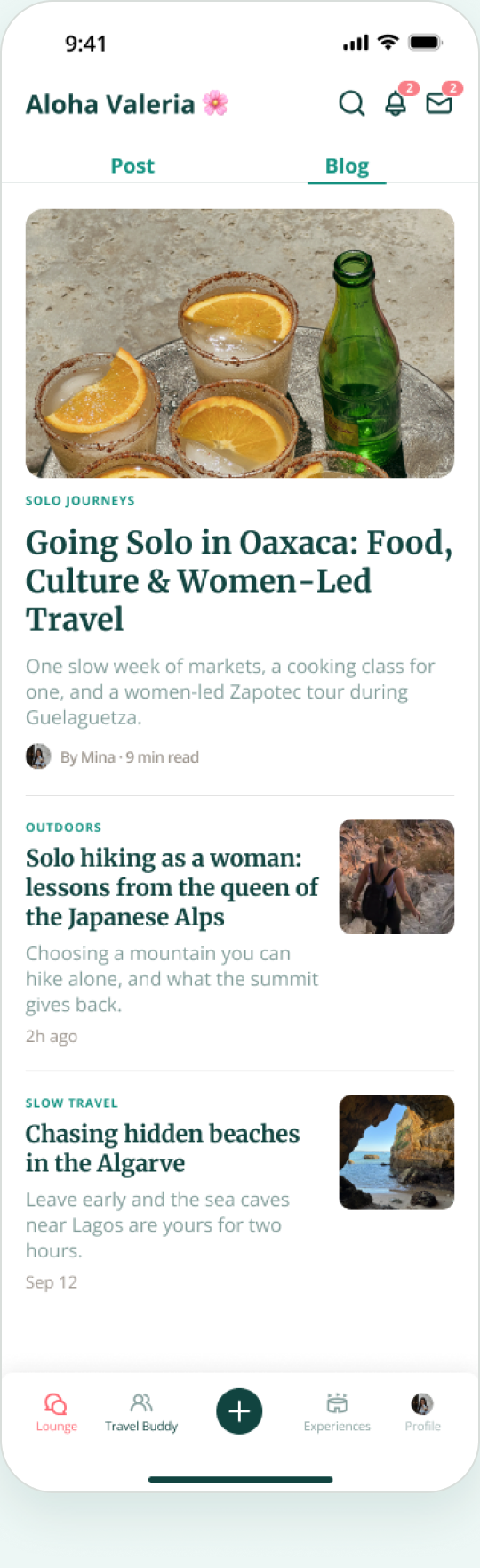 Mobile app screen showing a blog feed with travel articles including 'Going Solo in Oaxaca: Food, Culture & Women-Led Travel' featuring drinks with orange slices, 'Solo hiking as a woman' with a woman hiking in the Japanese Alps, and 'Chasing hidden beaches in the Algarve' with a sea cave view. The interface has navigation tabs Lounge, Travel Buddy, Experiences, and Profile at the bottom.