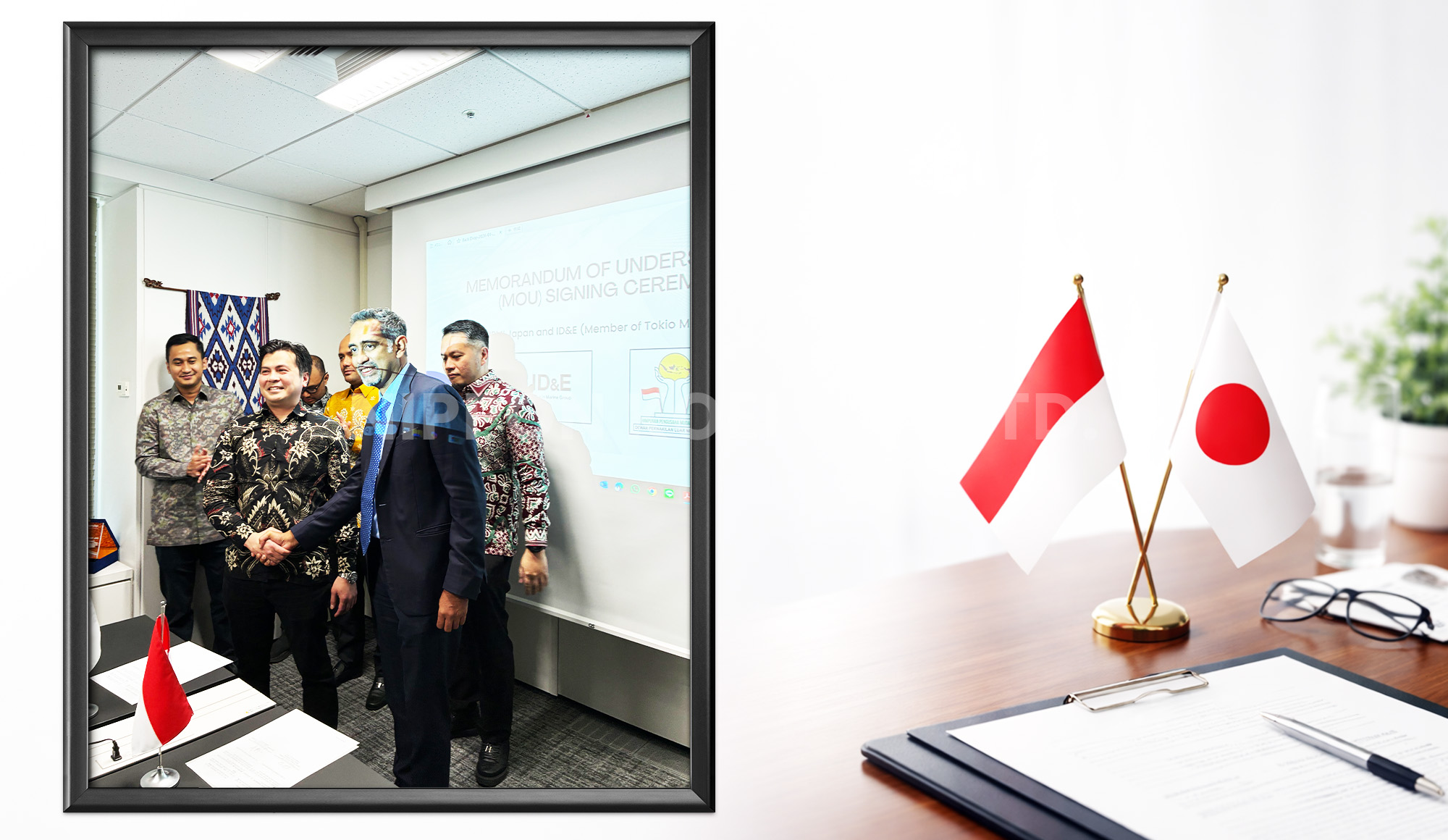 Group of men in batik and business attire shaking hands in an office during a memorandum of understanding signing ceremony with Indonesian and Japanese flags visible.