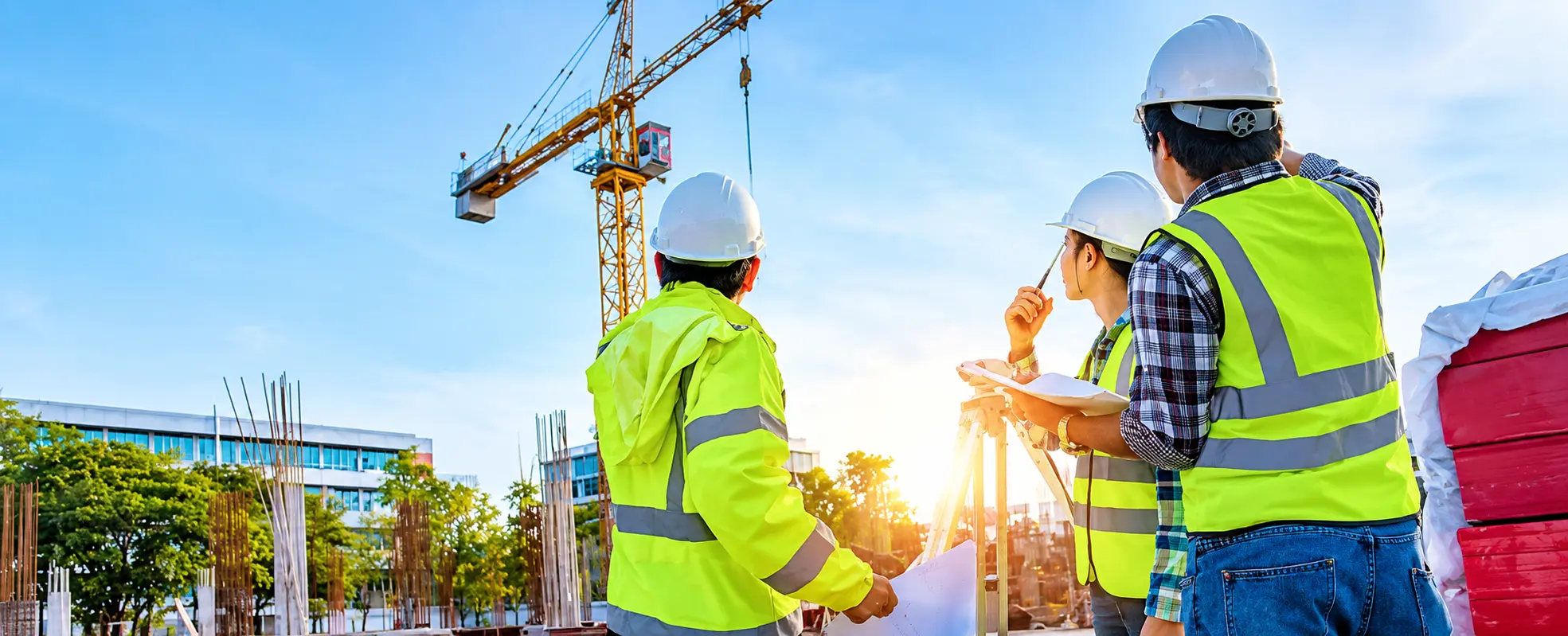 Nippon Koei engineers reviewing plans at a construction site