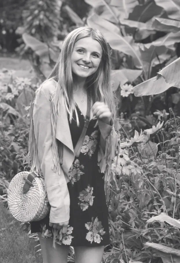 A black and white photo of Jessie Bayliss in a garden