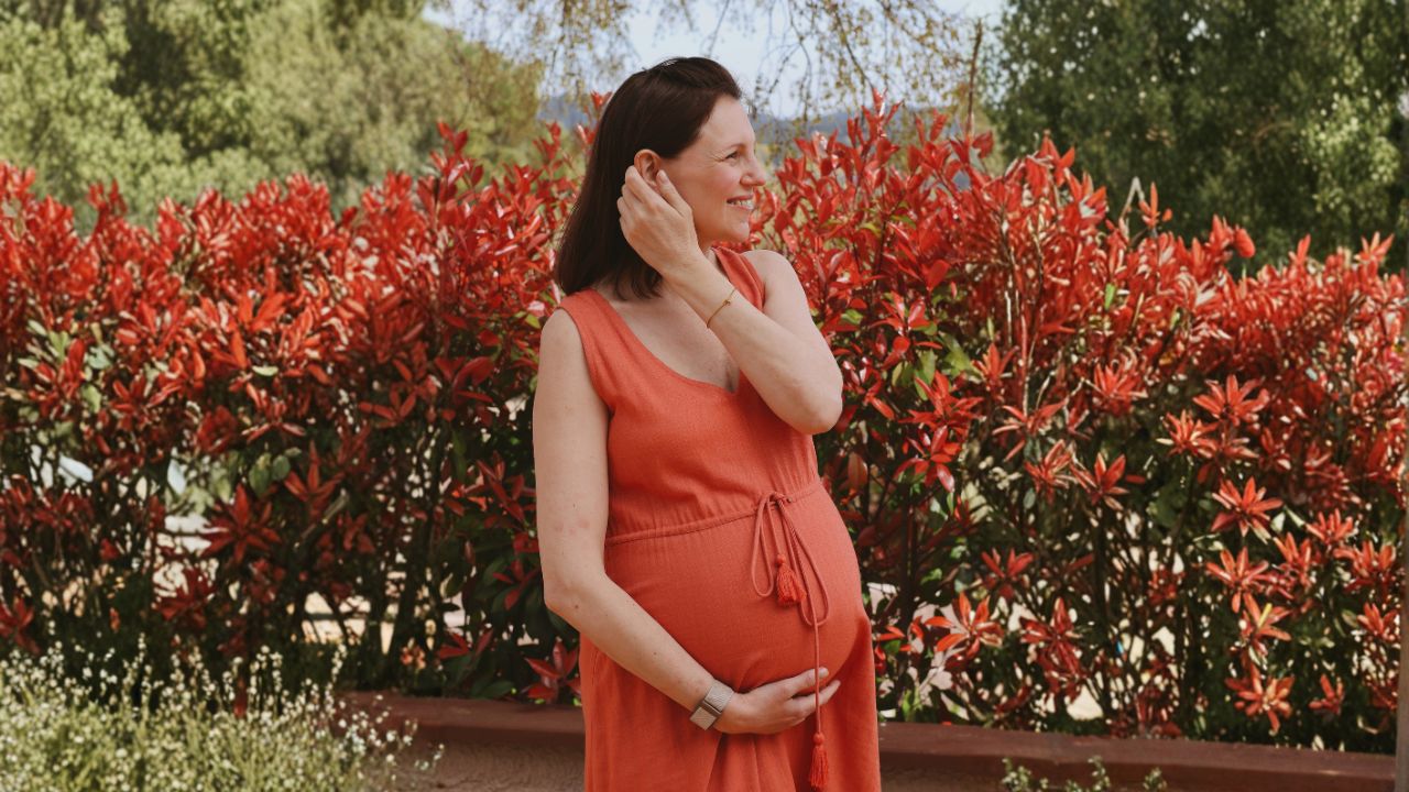 Pregnant woman in her third trimester in the gardens of a mom'z retreat