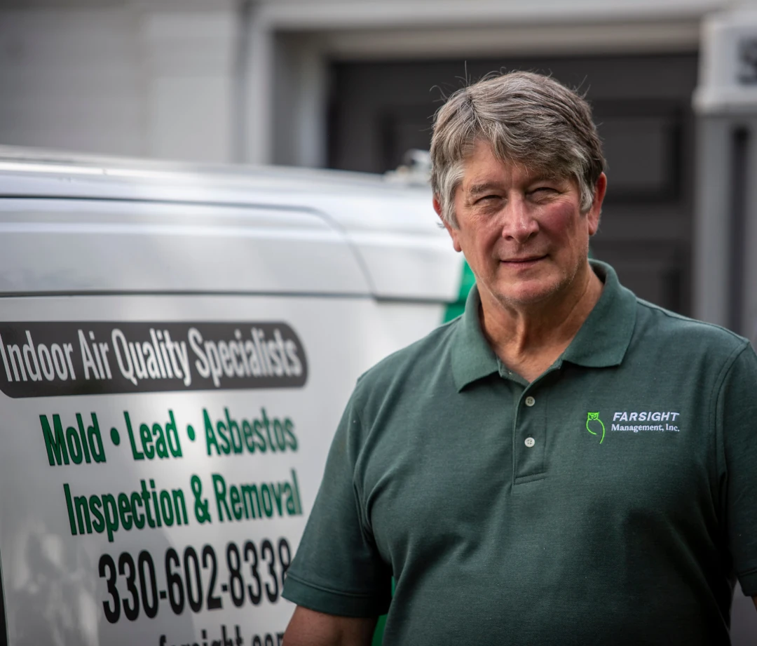 bob in front of branded vehicle