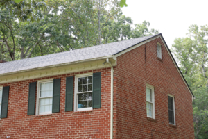 a brick house with a new roof in Lynchburg, VA