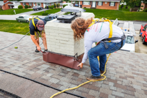 Repairs team fixing a chimney