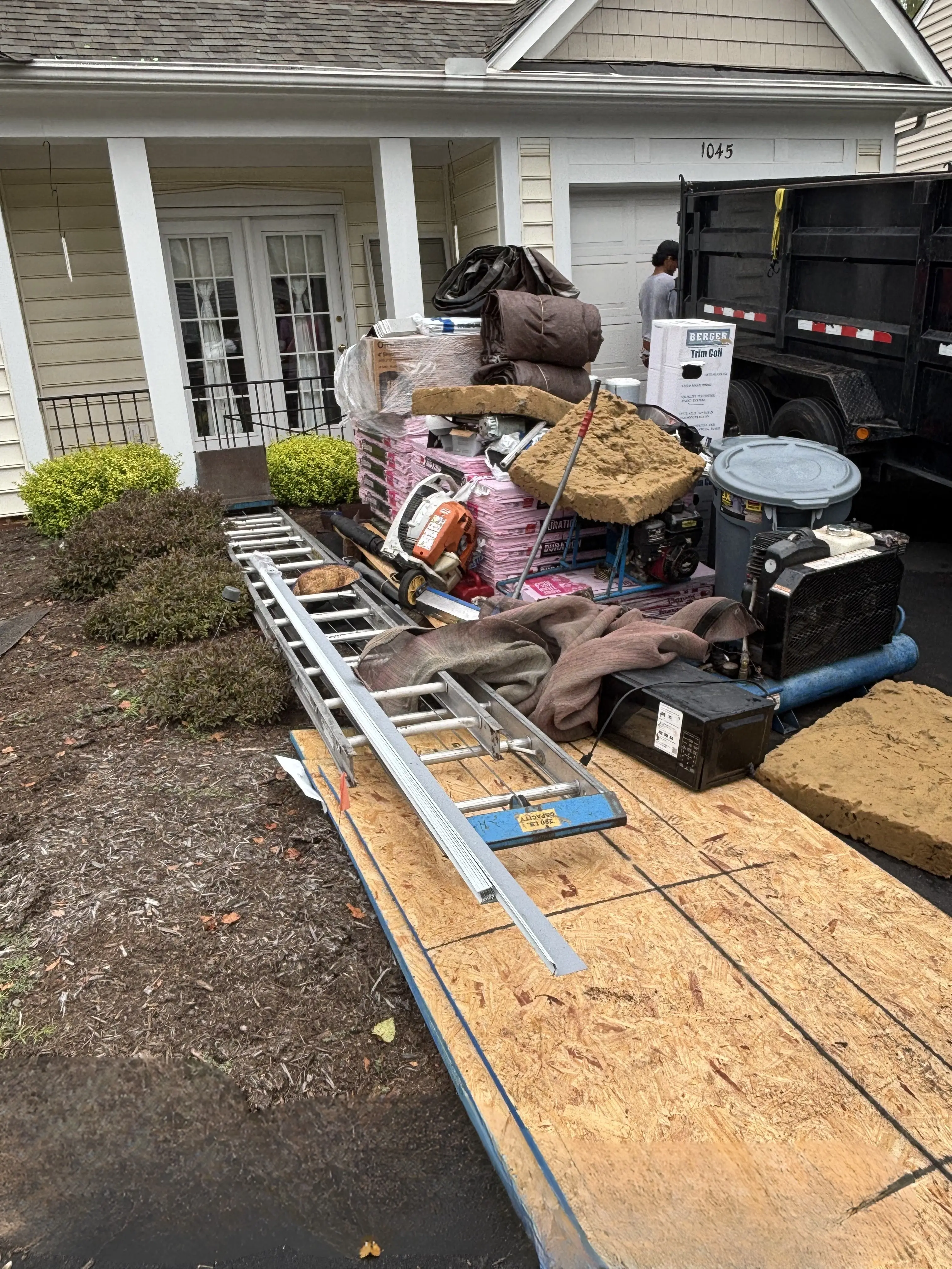 Equipment and safety materials staged before roof replacement in Charlottesville VA.