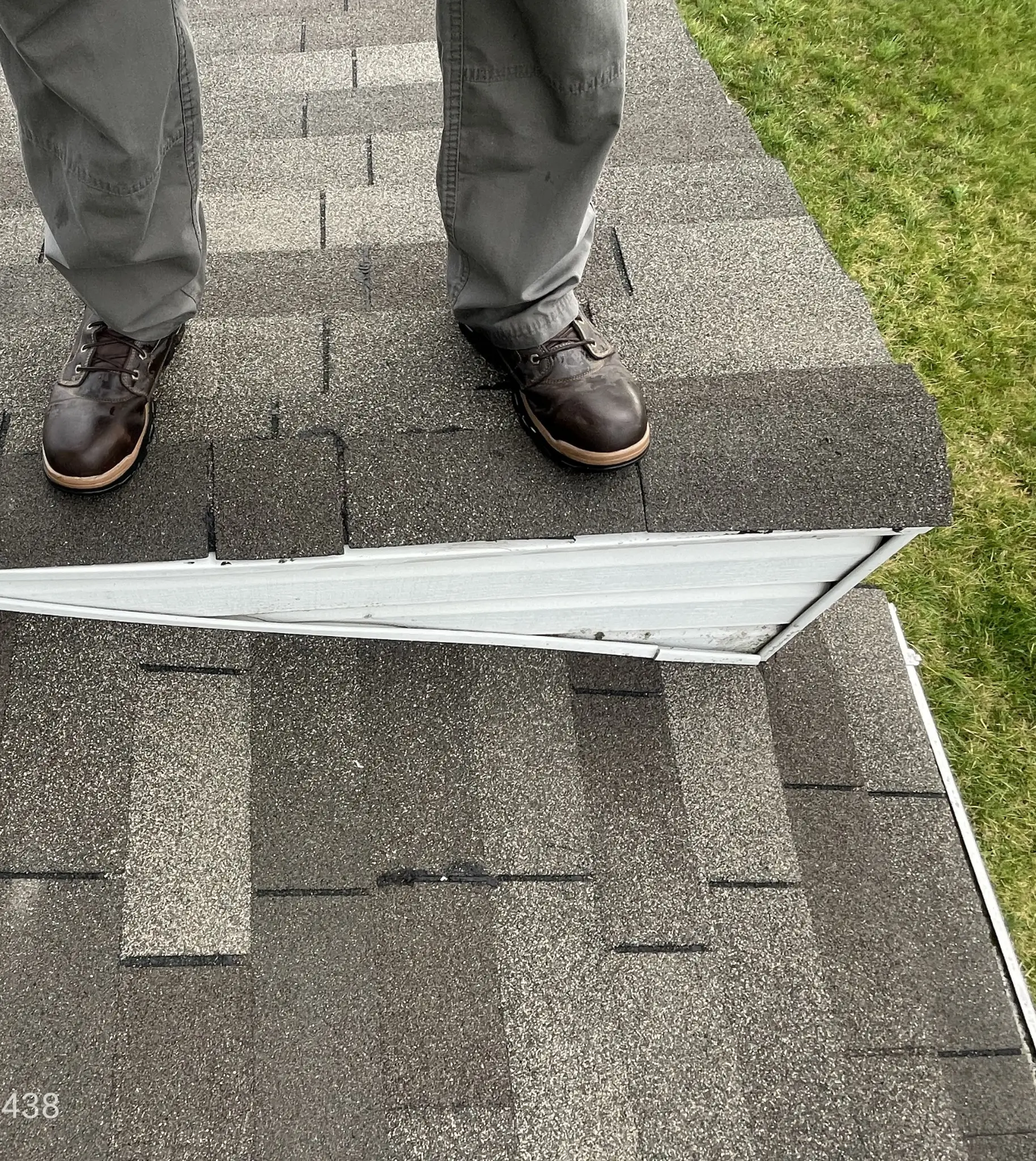 Roofer standing on the roof during a roof insepction
