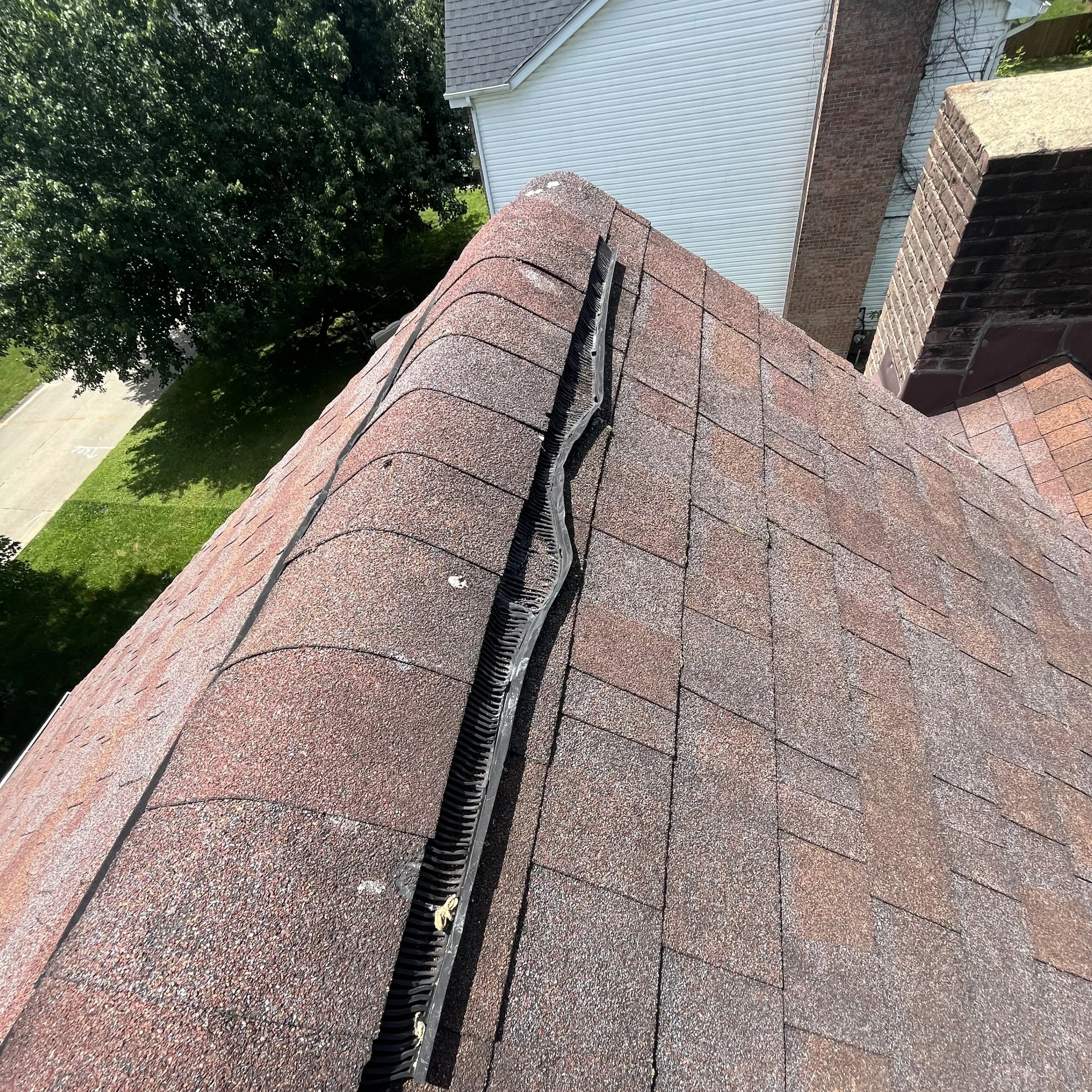 Completed steep 8/12-pitch roof replacement in Hurricane, WV with Owens Corning TruDefinition Duration architectural shingles installed by Cenvar Roofing