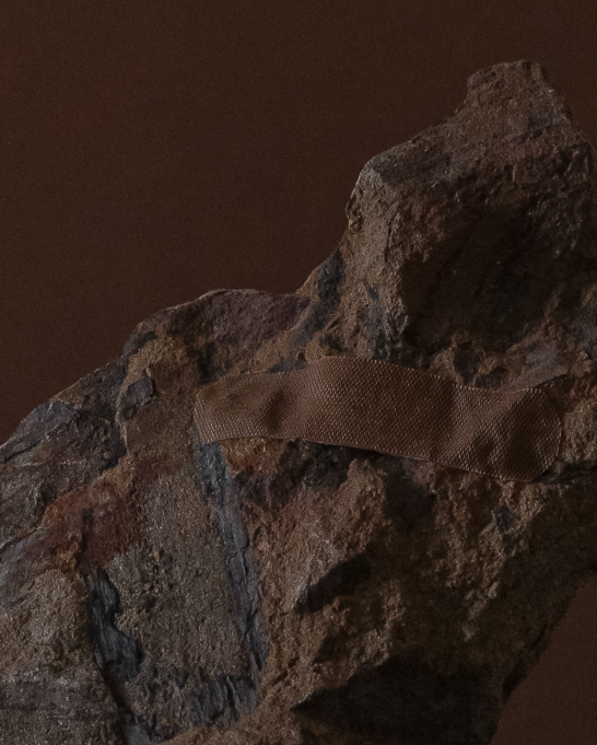 A jagged rock wearing a plaster