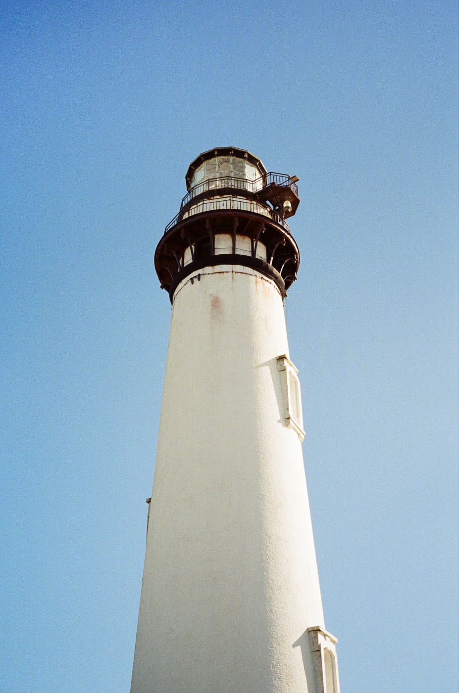 Photo of the top half of a lighthouse