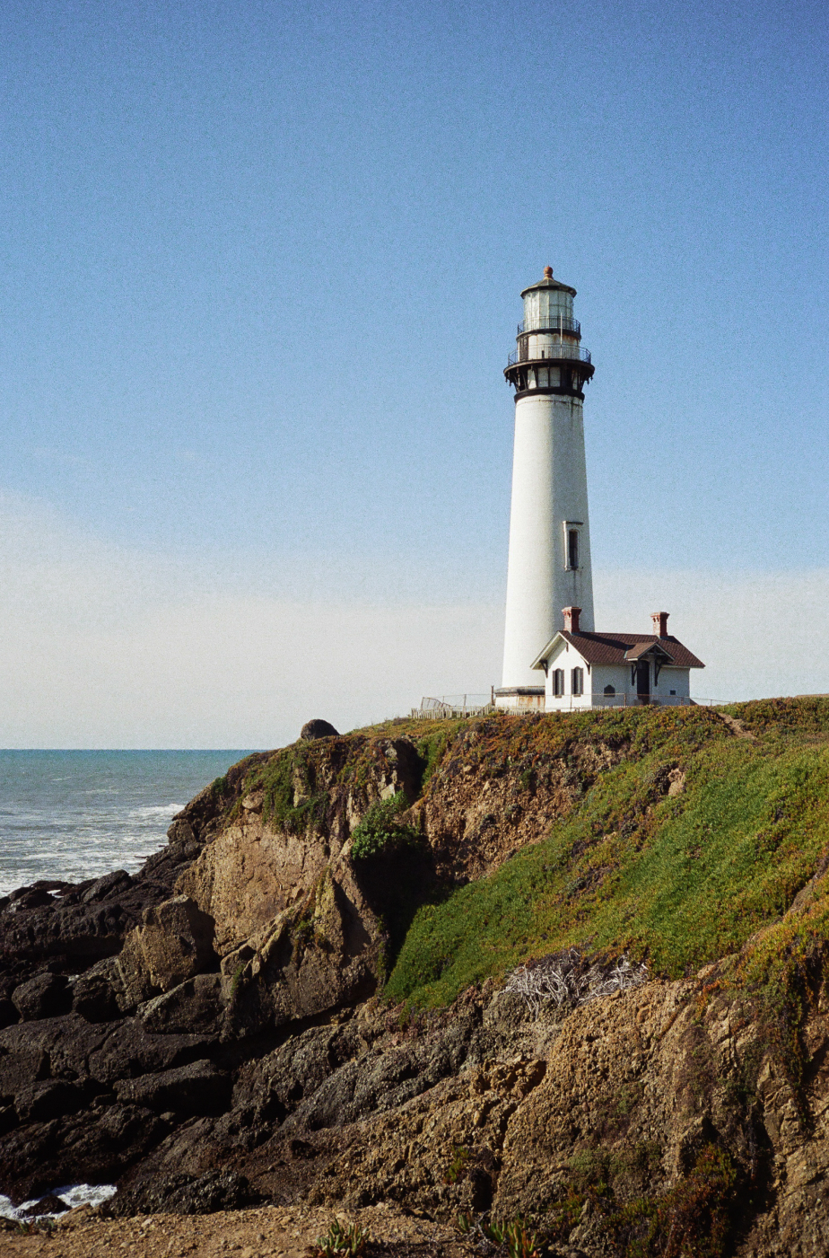 Photo of a lighthouse on a cliff