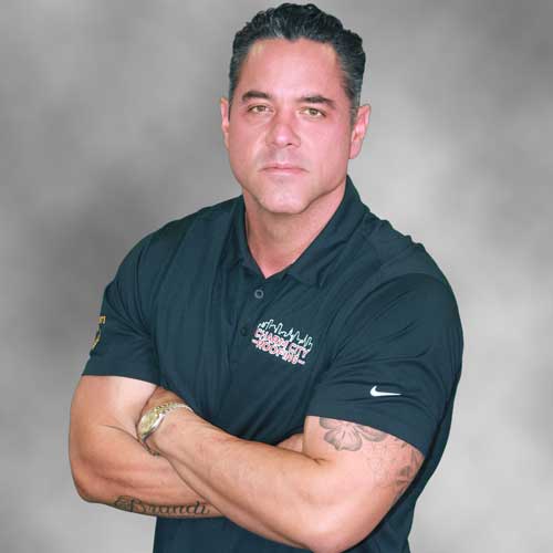 A headshot of Charm City Roofing Owner, Roger Bush.