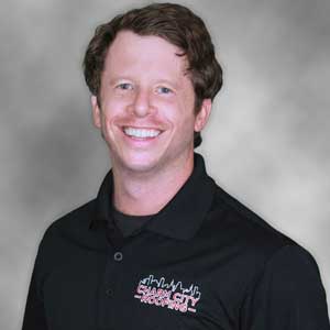 A headshot of Charm City Roofing project manager, Mark Tanner.